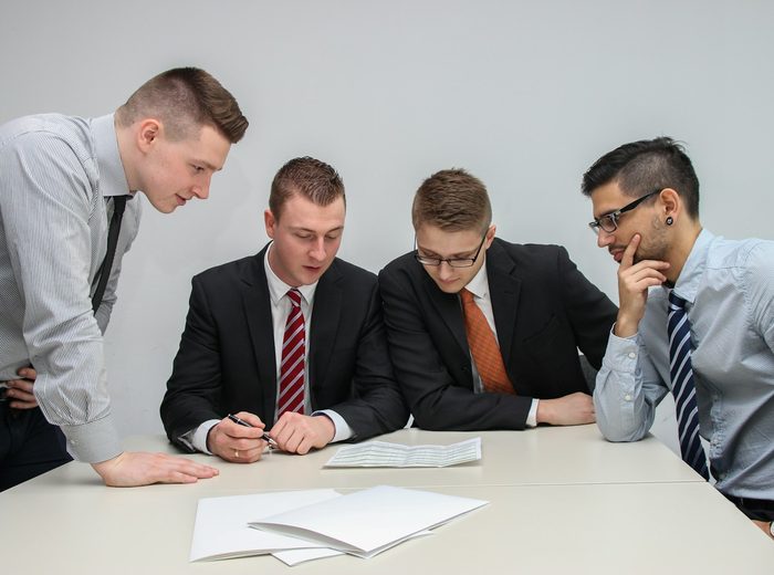 Bizacharya team reviewing a business plan with a client